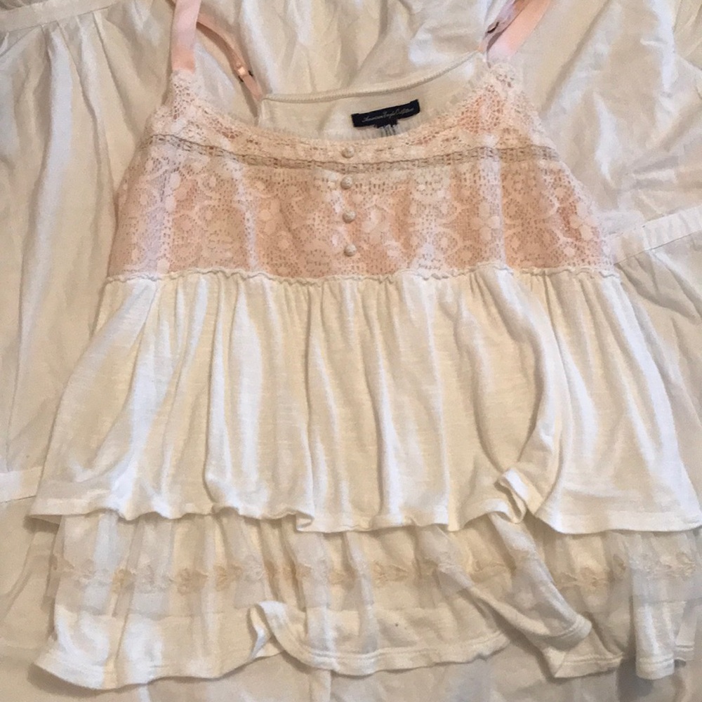White shirt with pastel pink accents